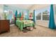 Fun bedroom featuring mountain wall art, a plush bear rug, and a bright window at 1551 S Grant St, Denver, CO 80210