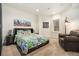 Cozy bedroom featuring soft carpet, a skyline art piece, and natural light at 1551 S Grant St, Denver, CO 80210