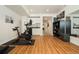 Home gym featuring an exercise bike, a weight bag, updated flooring, and bright lighting at 1551 S Grant St, Denver, CO 80210