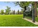 A beautiful park with large green space, mature trees, and well-maintained landscaping at 1551 S Grant St, Denver, CO 80210