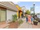 Charming street view with a Gathering walking by colorful storefronts at 1551 S Grant St, Denver, CO 80210