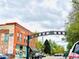 A vibrant street scene showcasing the charm of South Pearl Street's buildings and neighborhood atmosphere at 1551 S Grant St, Denver, CO 80210