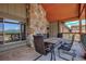 Balcony area with outdoor seating, showcasing stone columns and scenic mountain views at 107 Ski Watch Rd # 32, Breckenridge, CO 80424