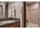 Stylish bathroom features a granite vanity, a decorative mirror, with a shower and tub combo at 107 Ski Watch Rd # 32, Breckenridge, CO 80424