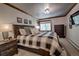Comfortable bedroom featuring a large bed, warm lighting, and a relaxing atmosphere at 107 Ski Watch Rd # 32, Breckenridge, CO 80424