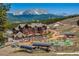 Scenic view of a charming mountain resort building with ski lifts, a playground, and mountain views at 107 Ski Watch Rd # 32, Breckenridge, CO 80424