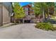 Exterior view of complex with rustic stone and timber elements leading to underground parking at 107 Ski Watch Rd # 32, Breckenridge, CO 80424