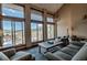 Inviting living room with scenic views through large windows and comfortable furnishings at 107 Ski Watch Rd # 32, Breckenridge, CO 80424