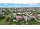 Stunning aerial view of a beautiful property with an expansive lawn and neighborhood in the background at 16491 Fairway Dr, Commerce City, CO 80022