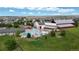 Aerial view of the community pool and recreation area with water slide, picnic tables, and playground at 16491 Fairway Dr, Commerce City, CO 80022