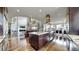 Gourmet kitchen with an island, stainless steel appliances, granite countertops, and an open concept design at 16491 Fairway Dr, Commerce City, CO 80022