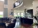 Spacious kitchen featuring stainless steel appliances, an island with seating, and hardwood floors at 16491 Fairway Dr, Commerce City, CO 80022