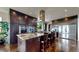 Gourmet kitchen with granite countertops, stainless steel appliances, and a large central island with barstool seating at 16491 Fairway Dr, Commerce City, CO 80022