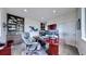 Well-appointed home office with built-in bookshelves, a spacious desk, and modern decor at 16491 Fairway Dr, Commerce City, CO 80022