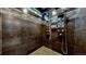 Modern shower with multiple shower heads and controls set against dark textured tiles at 16491 Fairway Dr, Commerce City, CO 80022