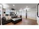 Home theater room with a large sectional, dark wood floors, and recessed lighting at 16491 Fairway Dr, Commerce City, CO 80022