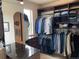Well-organized walk-in closet with custom shelving, hanging racks, and a central island at 16491 Fairway Dr, Commerce City, CO 80022