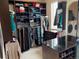 Spacious walk-in closet featuring extensive storage with shelves, hanging space, and a center island at 16491 Fairway Dr, Commerce City, CO 80022