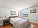 Cozy bedroom featuring natural light, warm wood floors, and a comfortable, inviting atmosphere at 1301 Speer Blvd # 702, Denver, CO 80204