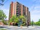 A view of the exterior of the Denver Tower apartment building at 1301 Speer Blvd # 702, Denver, CO 80204