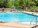 Inviting pool with clear blue water, surrounded by ample seating and lush landscaping, perfect for relaxation and recreation at 1301 Speer Blvd # 702, Denver, CO 80204