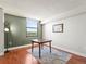 Bright dining room with a table, hardwood floors, natural light, and a clean, versatile space at 1301 Speer Blvd # 702, Denver, CO 80204