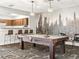 Inviting game room with a pool table, stylish lighting, and a charming mural, perfect for entertaining guests at 1301 Speer Blvd # 702, Denver, CO 80204