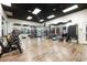 Spacious gym with wood floors, mirrored walls, spin bikes, and a variety of workout equipment at 1301 Speer Blvd # 702, Denver, CO 80204