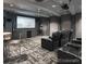 Private home theater with comfortable seating, a large screen, and modern décor for the ultimate movie experience at 1301 Speer Blvd # 702, Denver, CO 80204