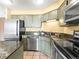 Functional kitchen featuring modern appliances, granite countertops and ample cabinet space at 1301 Speer Blvd # 702, Denver, CO 80204