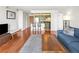 Open concept living space with hardwood flooring leading into an adjacent kitchen at 1301 Speer Blvd # 702, Denver, CO 80204