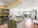 Open concept living space with kitchen, living room, and balcony access, all in view at 1301 Speer Blvd # 702, Denver, CO 80204