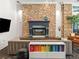 Stylish lounge featuring a stone fireplace, colorful bookshelf, and comfortable seating, creating a cozy and inviting atmosphere at 1301 Speer Blvd # 702, Denver, CO 80204