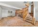 Finished basement with carpeted stairs and brick fireplace at 11199 Dahlia Pl, Thornton, CO 80233