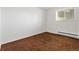 Empty bedroom with a window letting in light at 11199 Dahlia Pl, Thornton, CO 80233
