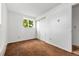 Bright bedroom with a large window and closet space at 11199 Dahlia Pl, Thornton, CO 80233