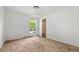 Simple bedroom with a window providing light and neutral carpet at 11199 Dahlia Pl, Thornton, CO 80233