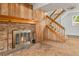 Close-up of brick fireplace with wood mantel and glass doors at 11199 Dahlia Pl, Thornton, CO 80233