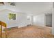Spacious living room area with two windows at 11199 Dahlia Pl, Thornton, CO 80233