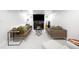 Finished basement with neutral carpet, fireplace, and ample seating at 2604 Elm St, Denver, CO 80207