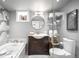 Beautiful bathroom featuring modern fixtures, including soaking tub and glass shower at 2604 Elm St, Denver, CO 80207