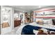 Well-designed bedroom with a built-in desk, open closet and playful sports themed decorations at 2604 Elm St, Denver, CO 80207