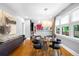 Bright dining room with modern lighting fixture and windows offering natural light at 2604 Elm St, Denver, CO 80207