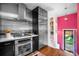 Contemporary kitchen with stainless steel appliances, sleek cabinetry, and an open layout, ideal for the modern home at 2604 Elm St, Denver, CO 80207