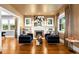 Bright living room featuring a fireplace, built-in shelving, and modern decor at 2604 Elm St, Denver, CO 80207