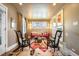Cozy living room with a colorful rug, stylish seating, and bright artwork at 2604 Elm St, Denver, CO 80207