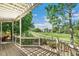 Inviting backyard deck with pergola, offering scenic views of the lush greenery and community walking paths at 3411 Springbriar Dr, Castle Rock, CO 80109