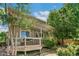 Charming backyard with a deck, pergola, lush landscaping, and a serene outdoor setting at 3411 Springbriar Dr, Castle Rock, CO 80109