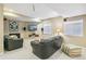 Finished basement featuring a cozy seating area, fireplace, mounted TV, and neutral carpet at 3411 Springbriar Dr, Castle Rock, CO 80109