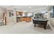 Spacious basement with wet bar, kitchenette, air hockey table, and entertainment area at 3411 Springbriar Dr, Castle Rock, CO 80109